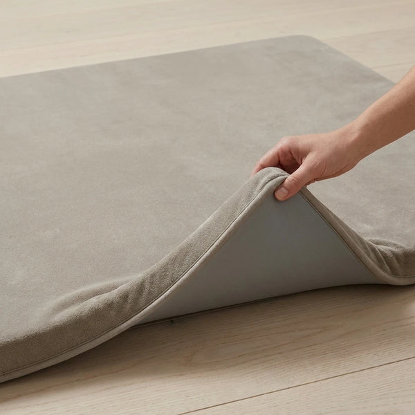 A corner of the mat folded back to show the non-slip backing